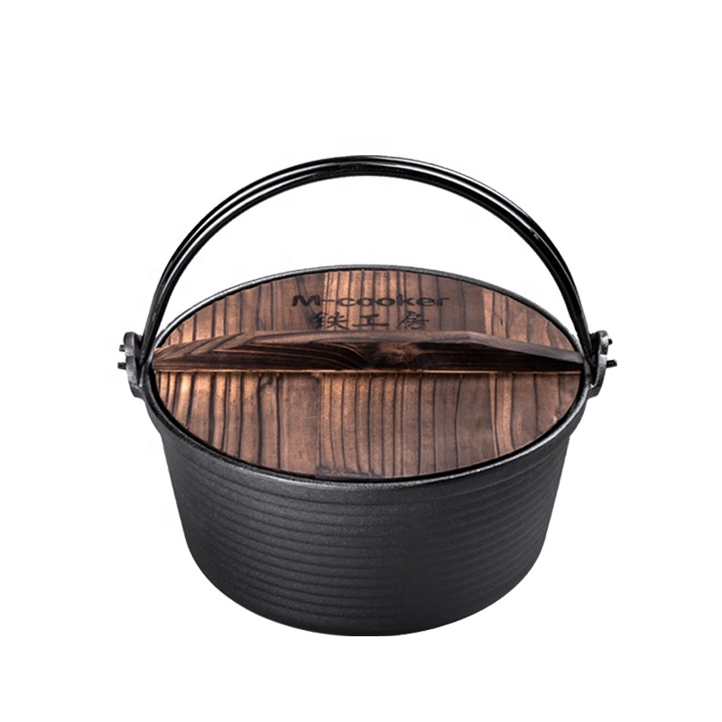 Cast iron dutch oven with vegetable oil coating and wooden lid