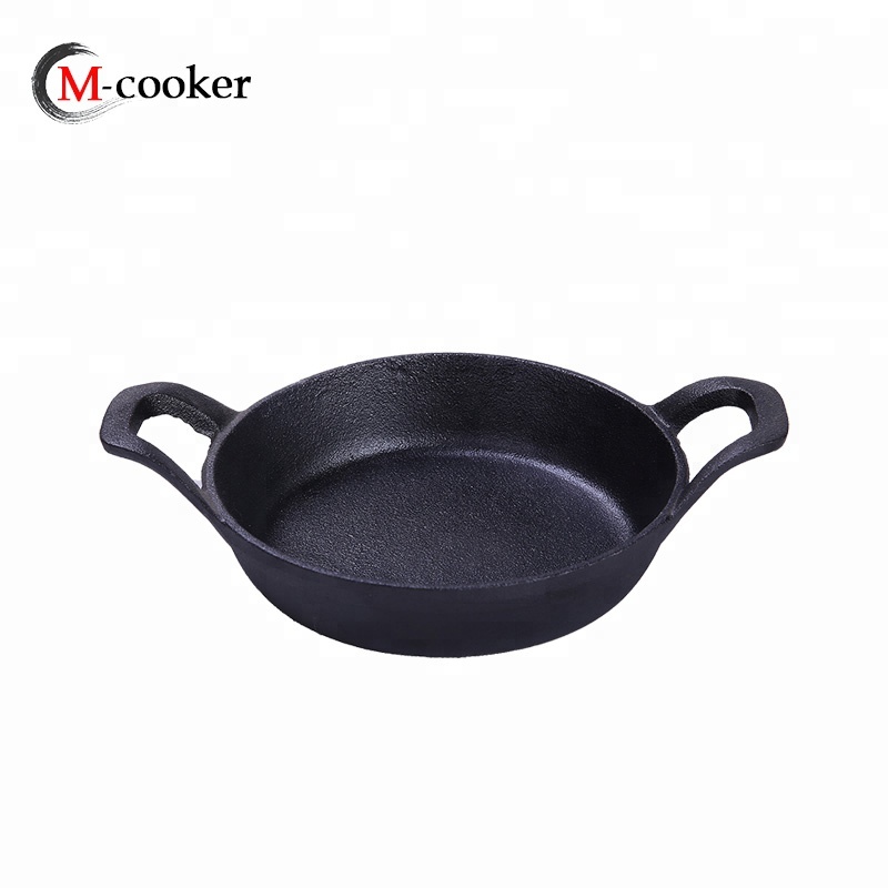 Small cast iron pizza pan with raised handle with pre-seasoned coating