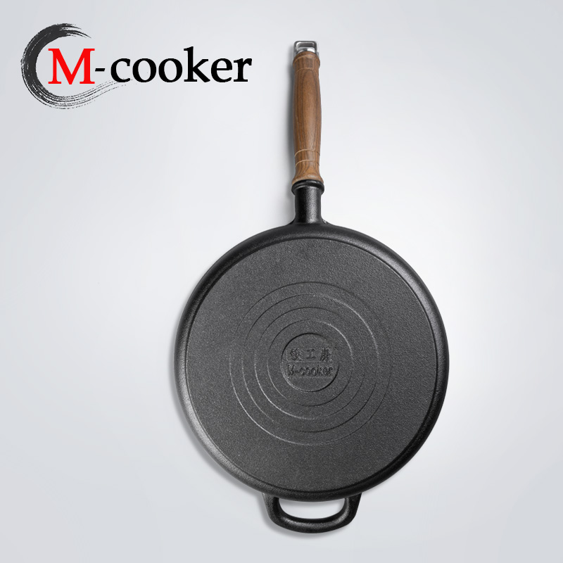 Cast iron fry pan with wooden handle